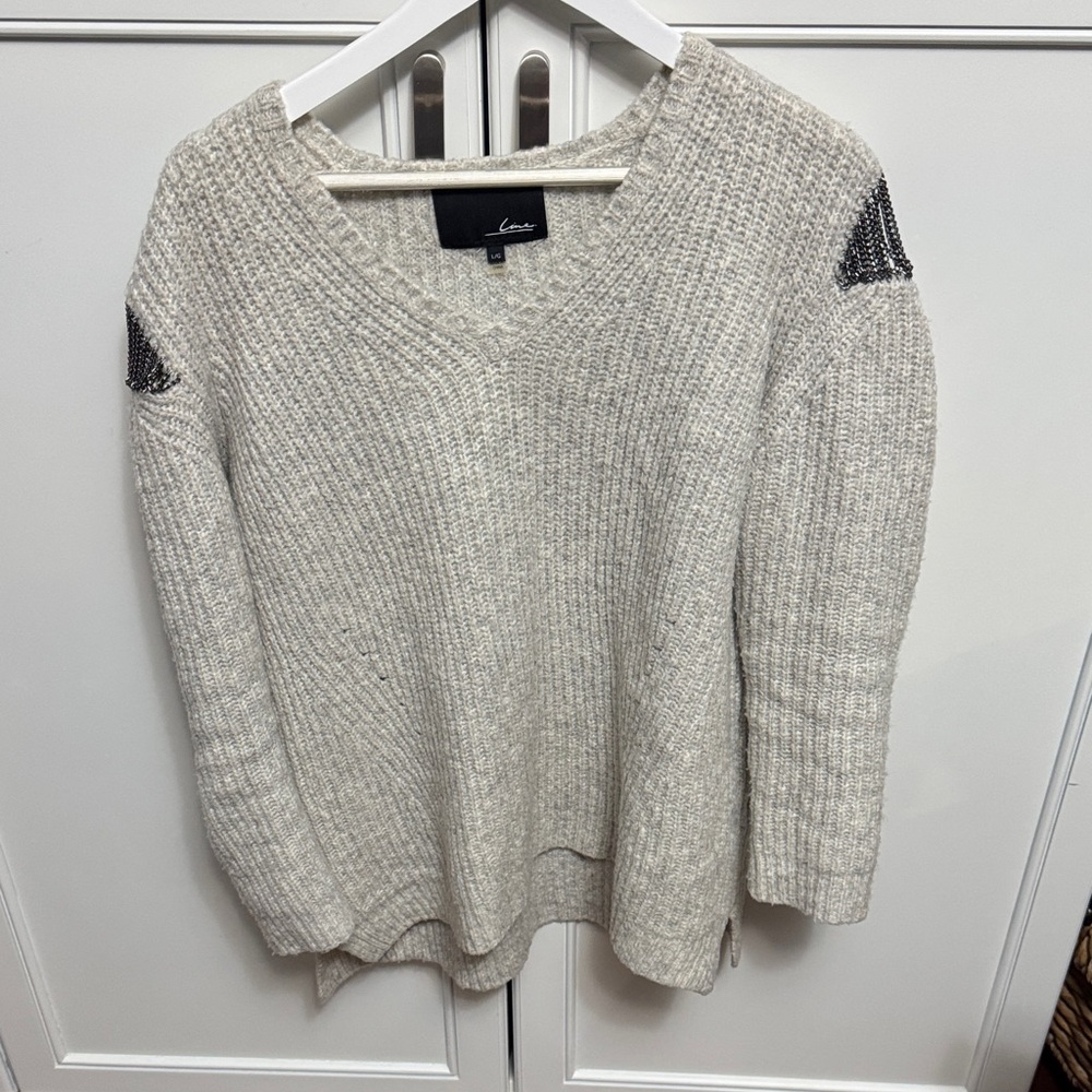 Line Women's V-Neck Sweater in Cream and Black chains on shoulder